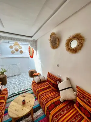 a living room with a couch and a table at Dar Salomi in Marrakech