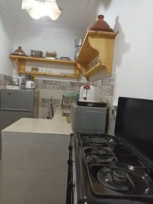 a kitchen with a stove and a counter top at Maison en exclusivité 2 chambre Place Jemma El Fna in Marrakech