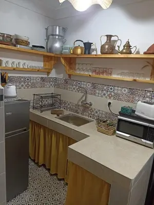 a kitchen with a sink and a counter top at Maison en exclusivité 2 chambre Place Jemma El Fna in Marrakech
