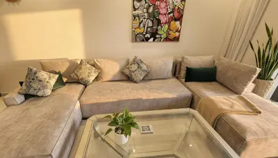 a living room with a couch and a glass table at Central Cozy Kesh - Pool - Terrace in Marrakech