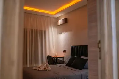 a child laying on a bed in a bedroom at Appart Duplex 3ch Piscine in Marrakech