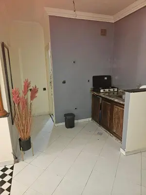 a kitchen with a counter and a refrigerator at Machaalah gueliz in Marrakech