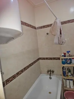 a bathroom with a tub and a sink at Machaalah gueliz in Marrakech