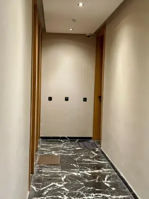 a hallway with a marble floor and two doors at Marrakech Elite Garden, moderne, chaleureux, tout équipé in Marrakech