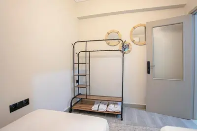 a room with a bed and a shelf with shoes at Luxury apartment with pool in Marrakech