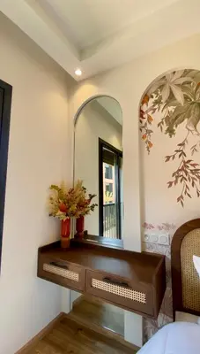 a dressing table in a bedroom with a mirror at Alba cosy - 3 piscines, Wifi HD, Parc de jeux in Marrakech