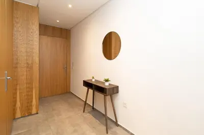 a hallway with a table and a mirror on the wall at Appartement gueliz, hyper centre in Marrakech