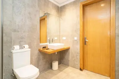 a bathroom with a toilet and a sink at Appartement gueliz, hyper centre in Marrakech