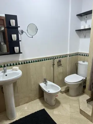 a bathroom with a toilet and a sink at hébergement in Guéliz in Marrakech