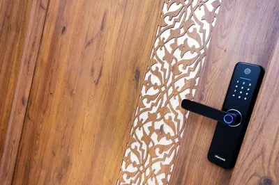 a remote control sitting on a floor next to a table at Modern apartment-pool-secure Gueliz in Marrakech