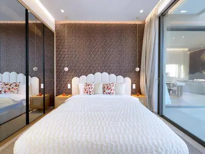 a bedroom with a white bed and a large window at Villa de Luxe Sans Vis-à-Vis 15 min de Marrakech in Marrakech