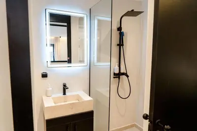 a bathroom with a sink and a shower at Studio Chic Coeur de Gueliz in Marrakech