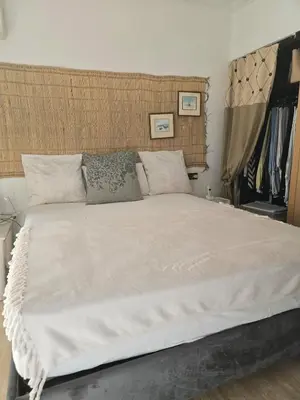 a bedroom with a large white bed with two pillows at La Terrasse in Marrakech