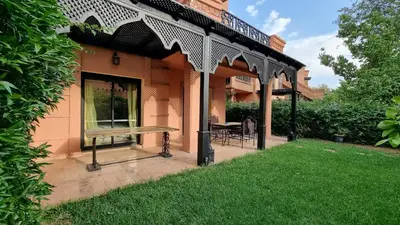 a pavilion with a bench in a yard at Dar Saad Atlas golf in Marrakech