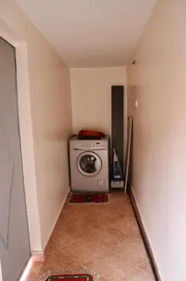a washer and dryer in a small room at Ryad OMS Marrakech in Marrakech