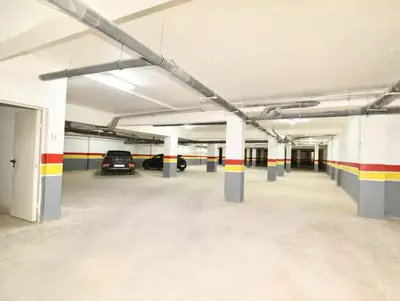 an empty parking garage with cars parked in it at Duplex Moderne et Confort in Marrakech
