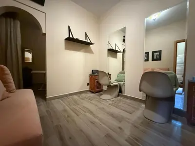 a room with a bedroom with a bed and a desk at Luxury Villa Pool with Atlas View in Moussiha
