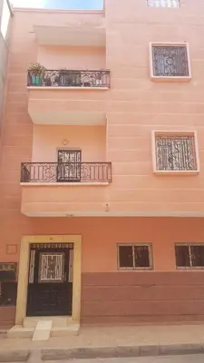a building with two windows and two balconies at Home for peace & enjoyment in Marrakech
