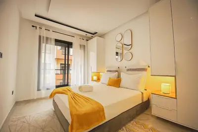 a bedroom with a large bed and a window at Laube Hivernage in Marrakech