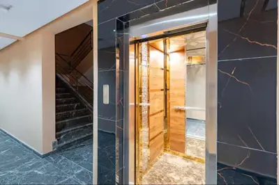a hallway with a glass door and stairs at Laube Hivernage in Marrakech
