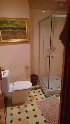 a bathroom with a toilet and a glass shower at Appartement Majorella Gueliz Centre Marrakech in Marrakech