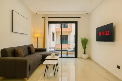 a living room with a couch and a table at Cozy Studio in Hivernage 31 in Marrakech