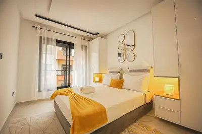 a bedroom with a large bed and a window at Cozy Studio in Hivernage 31 in Marrakech