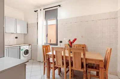a kitchen and dining room with a table and chairs at Modern Elegance & Moroccan Charm - Gueliz Center in Marrakech
