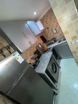 an overhead view of a kitchen with a refrigerator at Appartement de luxe 15 mn du centre in Marrakech