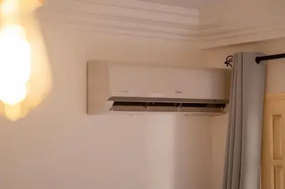a microwave oven on a wall in a room at Appartement yasmina in Marrakech