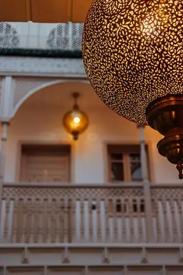 a large chandelier hanging in front of a house at Riad Le Terracotta in Marrakech