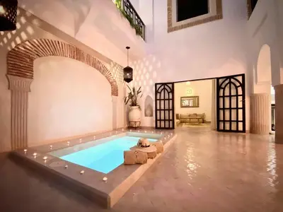 an indoor pool with a teddy bear in the middle of a room at Riad Madame Riad privé à deux pas de la Place Jemaa El Fna in Marrakech