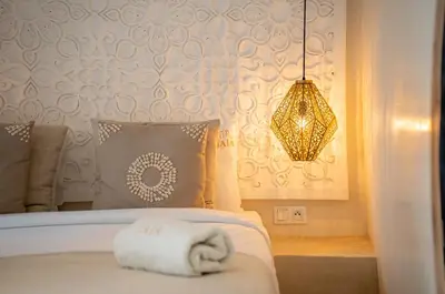 a hotel room with a bed with a towel on it at Riad JAIA in Marrakech