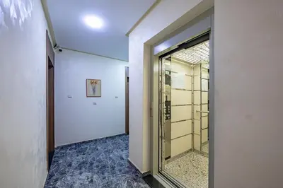 a hallway with a glass door in a building at Urban Dream piscine et central in Marrakech