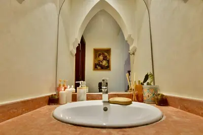 a bathroom with a large white sink in a building at DarKech luxury and comfort in Marrakech