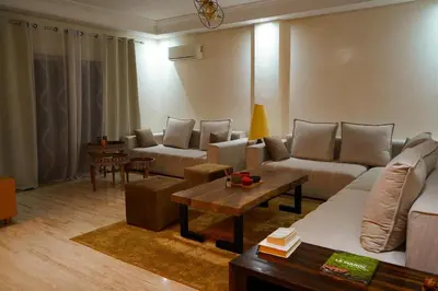 a living room with a couch and a table at duplex a Gueliz in Marrakech