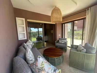 a living room with a couch and a table at Relax appartement in Marrakech