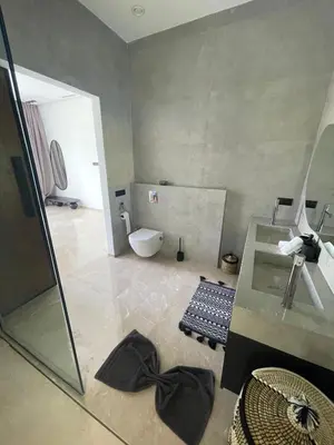 a bathroom with a shower and a sink and a toilet at Villa les palmiers in Marrakech