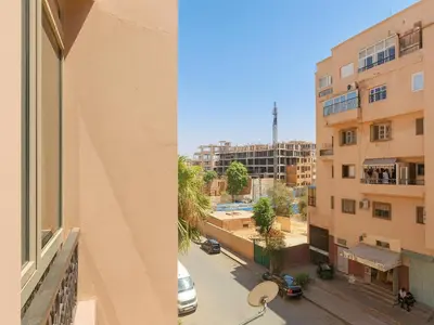 a view of a street from a building at Bright 2-BR - Balcony & Parking - Fast Wi-Fi - Near Route de Casa in Marrakech