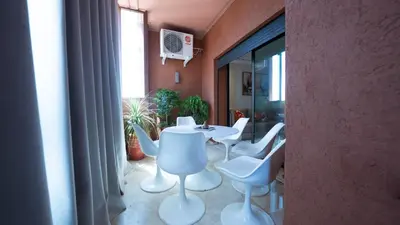 a room with a table and chairs and a window at Chic City Studio in Marrakech in Marrakech