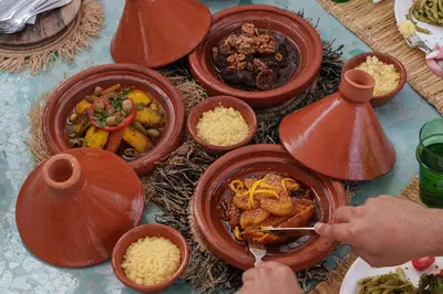 a table with bowls of food on a table at Riad Dar Amani in Marrakech
