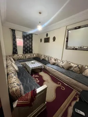 a living room with a couch and a table at Dar wafa in Marrakech