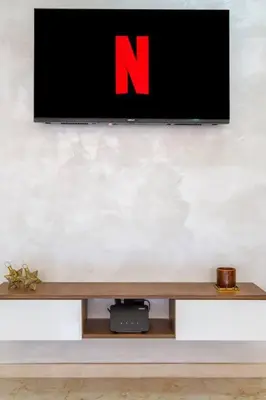 a flat screen tv on a white wall at Heart of Marrakech - Hivernage 2 bedroom apartment in Marrakech
