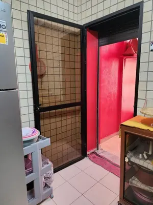 an open door to a kitchen with a red door at Comfortable apartment for families in Marrakech