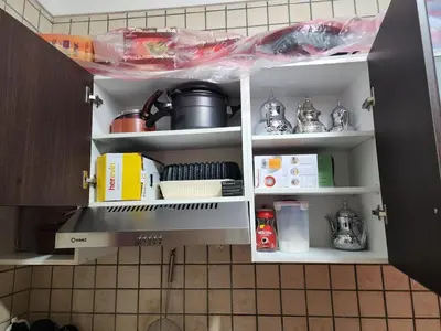 a kitchen pantry with a sink and some food at Comfortable apartment for families in Marrakech