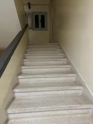 a stairway leading up to a door in a building at Kueerland in Marrakech