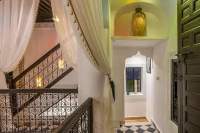 a staircase in a house with a window and a stair case at Dar Bonita in Marrakech