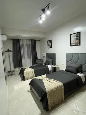 a hotel room with two beds in a room at GZ Loft in Marrakech