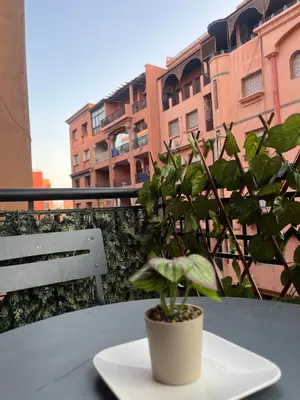 a plate with a plant on a table with a building at GZ Loft in Marrakech