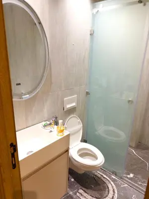 a bathroom with a toilet and a sink and a shower at Appartement à Marrakech in Marrakech